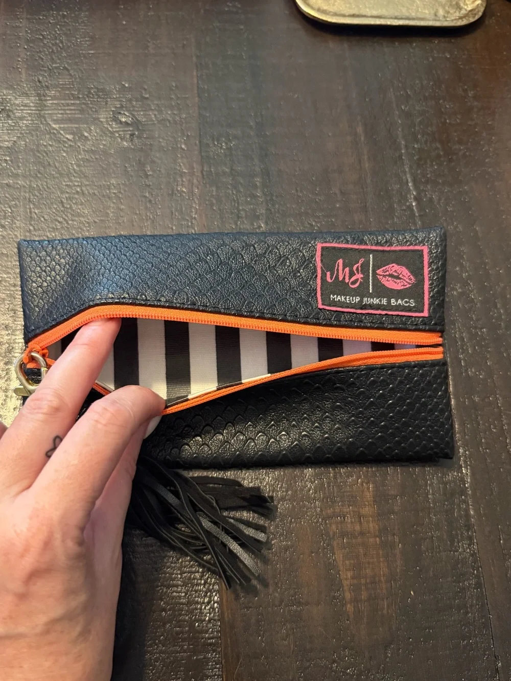 Makeup Junkie- Mini Black Cosmetic Clutch with Orange Zip and Tassel